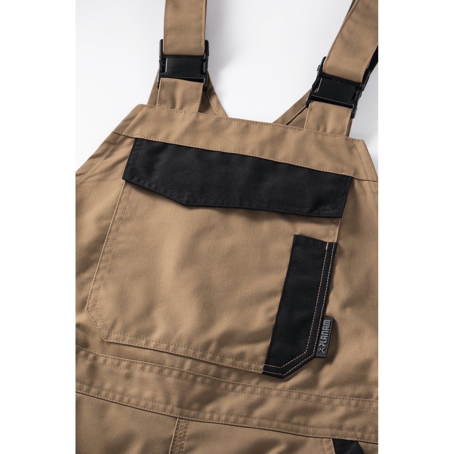 Planam Norit Women's dungarees slate/black - The bib with zip closure and bib pocket provide plenty of storage space.
