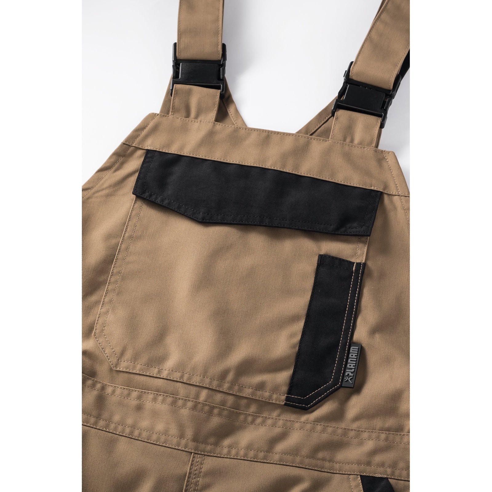 Planam Norit Women's dungarees black/black - The bib with zip closure and bib pocket provide plenty of storage space.